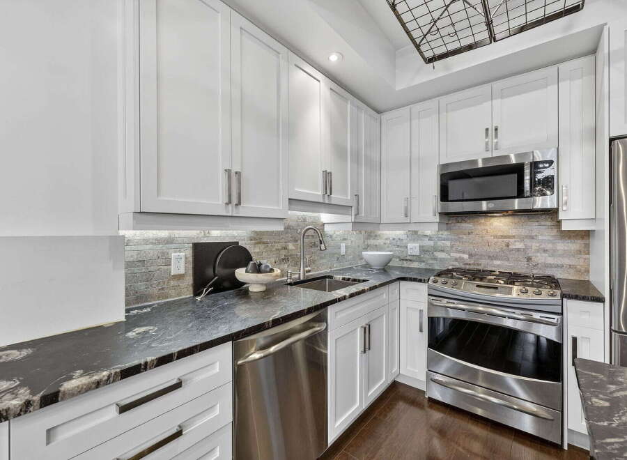 This stunning kitchen boasts modern design and high-end appliances.