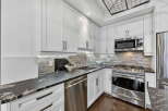 This stunning kitchen boasts modern design and high-end appliances.