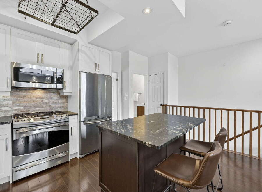 This stunning kitchen boasts modern appliances and elegant design.