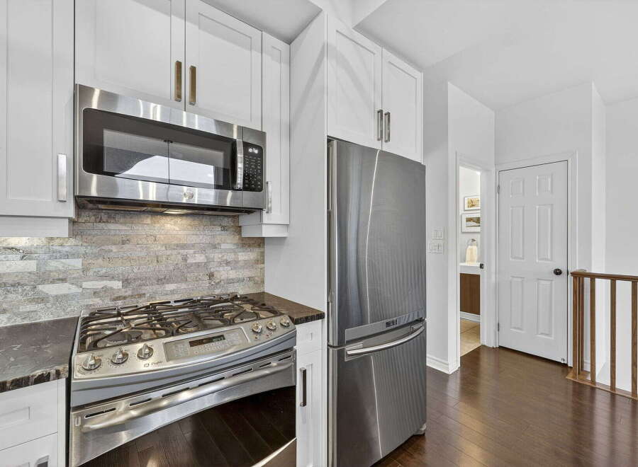 This stunning kitchen boasts modern appliances and elegant design.