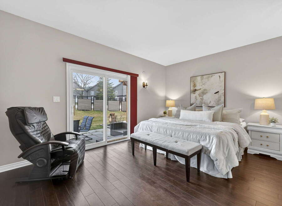 Step into luxury in this stunning bedroom! Featuring a spacious layout, this room boasts a comfortable bed, a stylish bench, and a relaxing massage chair.