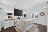 This stunning bedroom boasts a modern design with a touch of elegance.