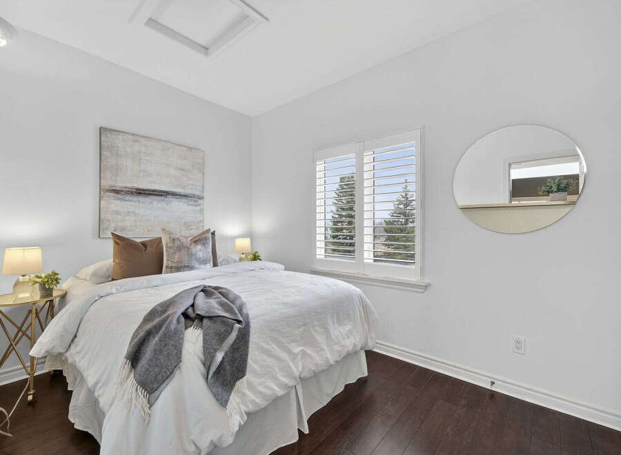 This stunning bedroom boasts a bright and airy atmosphere, perfect for relaxation.