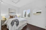 This stunning bedroom boasts a bright and airy atmosphere, perfect for relaxation.