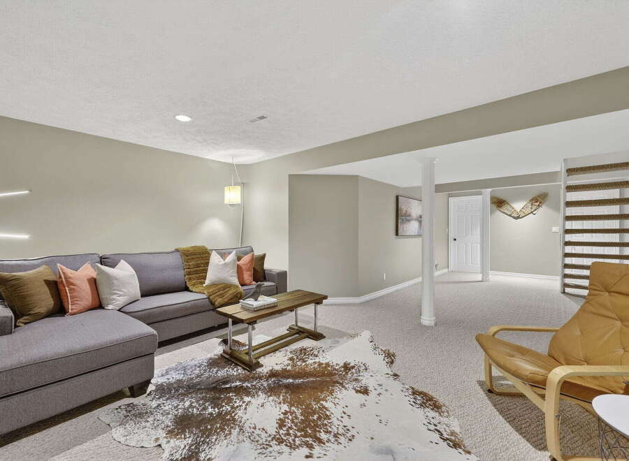 This inviting living space features a stylish sectional sofa, perfect for relaxing and entertaining.