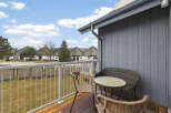 Enjoy serene outdoor living on this charming balcony, perfect for morning coffee or evening relaxation.