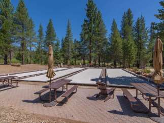 Enjoy outdoor recreation at this property featuring bocce ball courts, perfect for friendly competition.