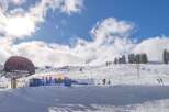 Enjoy the winter wonderland at this stunning ski resort! This property boasts breathtaking views of snow-covered slopes and a vibrant blue sky.