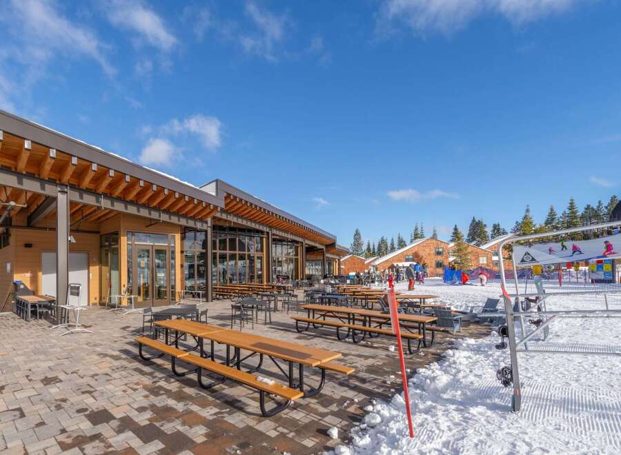 This stunning property boasts a modern design with expansive windows, offering breathtaking views of the surrounding landscape.