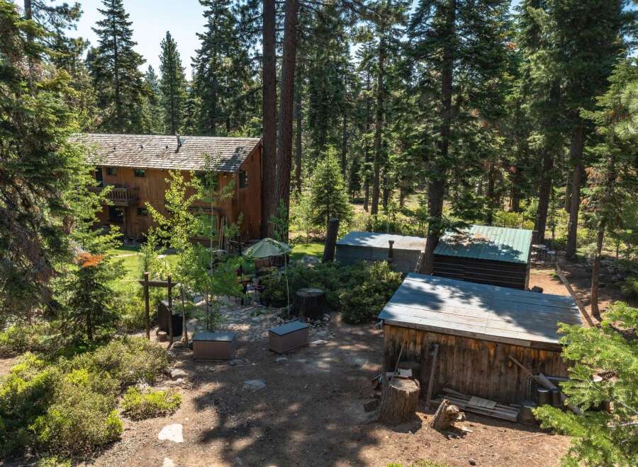 Nestled in a serene forest setting, this property offers a unique blend of rustic charm and natural beauty.