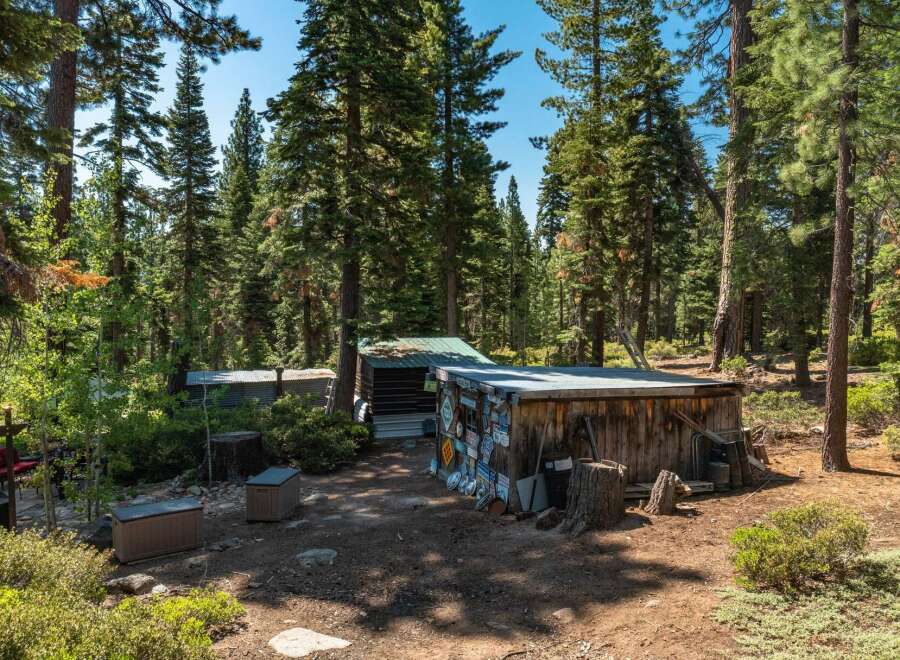 Nestled in a serene forest setting, this property offers a unique retreat.