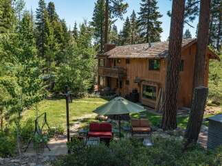 Nestled in a serene, wooded setting, this stunning property offers a perfect blend of nature and comfort.