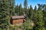 Nestled amidst a lush forest, this stunning property offers a serene escape.