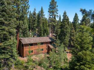 Nestled amidst a lush forest, this stunning property offers a serene escape.