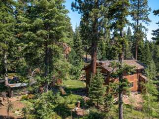 Nestled amidst a lush forest, this stunning property offers a serene retreat.