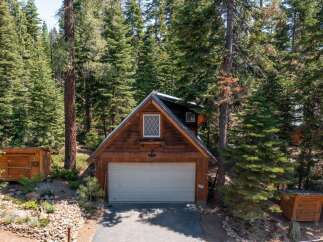 Nestled in a serene forest setting, this charming cabin offers a perfect blend of rustic charm and modern convenience.