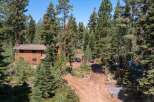 Nestled amidst towering trees, this stunning property offers a serene escape.