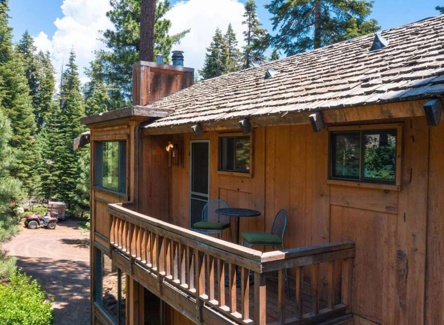 Nestled amidst towering trees, this charming cabin offers a serene escape.