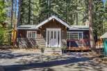 Nestled amidst towering trees, this charming cabin offers a serene escape.