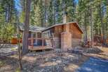 Nestled amidst towering trees, this charming cabin offers a serene escape.