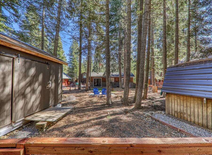Nestled amongst towering trees, this charming property offers a serene escape.
