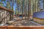 Nestled amongst towering trees, this charming property offers a serene escape.