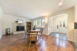 This charming home features a cozy living space with a fireplace, perfect for relaxing evenings.