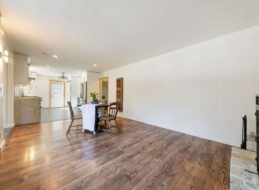 Step into this inviting home featuring a spacious living area with beautiful hardwood floors.