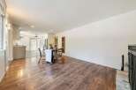 Step into this inviting home featuring a spacious living area with beautiful hardwood floors.