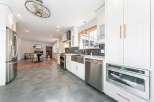 Step into this stunning kitchen, boasting modern design and high-end appliances.