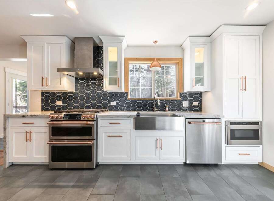 This stunning kitchen boasts modern design with high-end appliances and finishes.