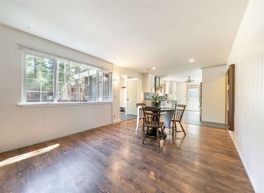 Step into this inviting home featuring a bright and airy living space with beautiful hardwood floors.