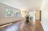 Step into this inviting home featuring a bright and airy living space with beautiful hardwood floors.