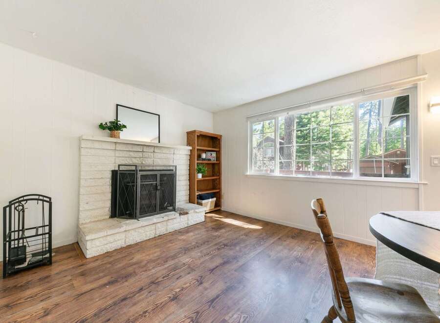 This charming living room features a cozy fireplace, perfect for those chilly evenings.