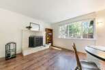 This charming living room features a cozy fireplace, perfect for those chilly evenings.