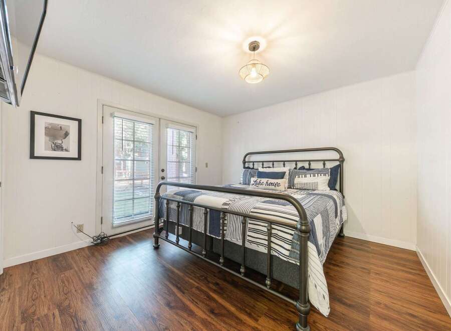 This charming bedroom features a cozy ambiance with its inviting decor and ample natural light.