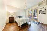 This cozy bedroom offers a serene retreat with its inviting ambiance and natural light.