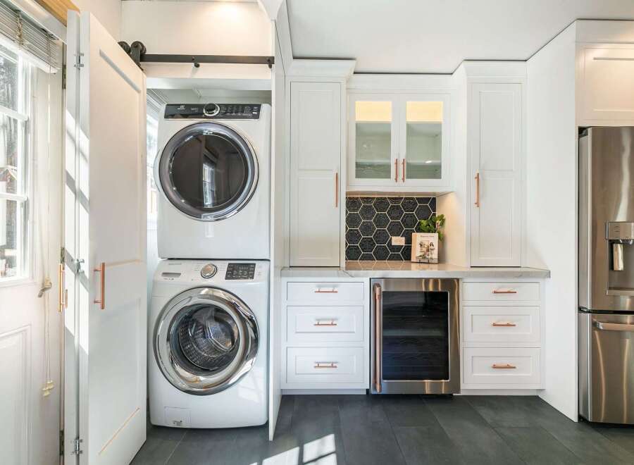 This stunning laundry room boasts modern design and functionality.