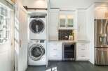 This stunning laundry room boasts modern design and functionality.