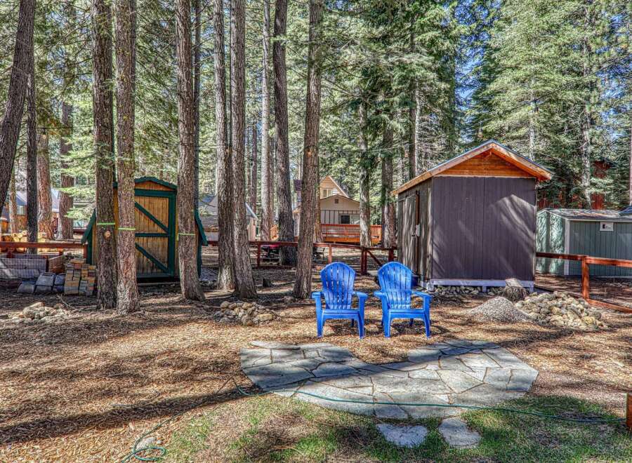 Nestled amongst towering trees, this property offers a serene escape.