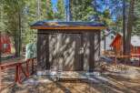 This charming property features a well-maintained shed with a sliding door, perfect for storage or a workshop.