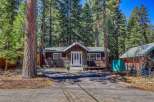 Nestled amidst towering trees, this charming cabin offers a serene escape.