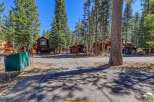 Nestled amidst towering trees, this charming property offers a serene escape.