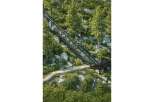 Experience breathtaking views from this unique property featuring a scenic mountain railway and a charming stone-lined pathway.