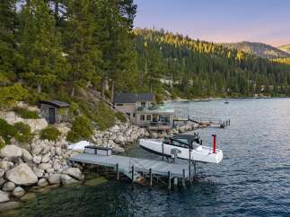 Experience luxury lakeside living with this stunning property featuring a private dock and boat lift, perfect for water enthusiasts.