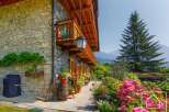 Discover the charm of this stunning property, featuring a beautiful stone facade and a welcoming balcony.