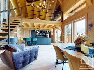 Experience luxury living in this stunning chalet, showcasing exquisite wooden architecture and a modern interior.