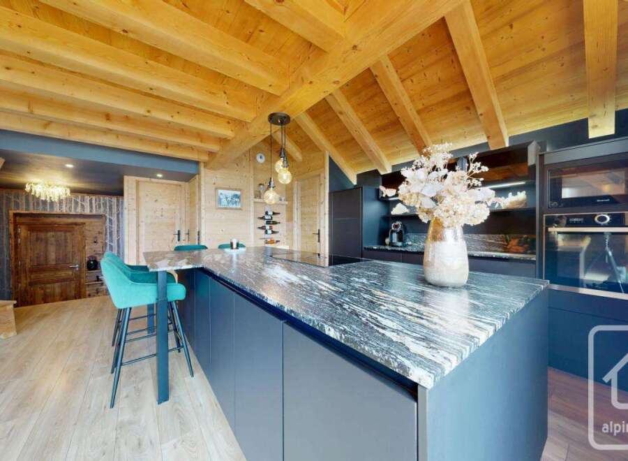 Experience luxury living in this stunning property featuring a modern kitchen with granite countertops and sleek cabinetry.