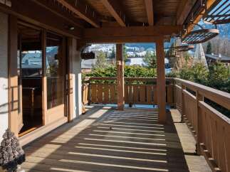 Enjoy breathtaking mountain views from this charming balcony.