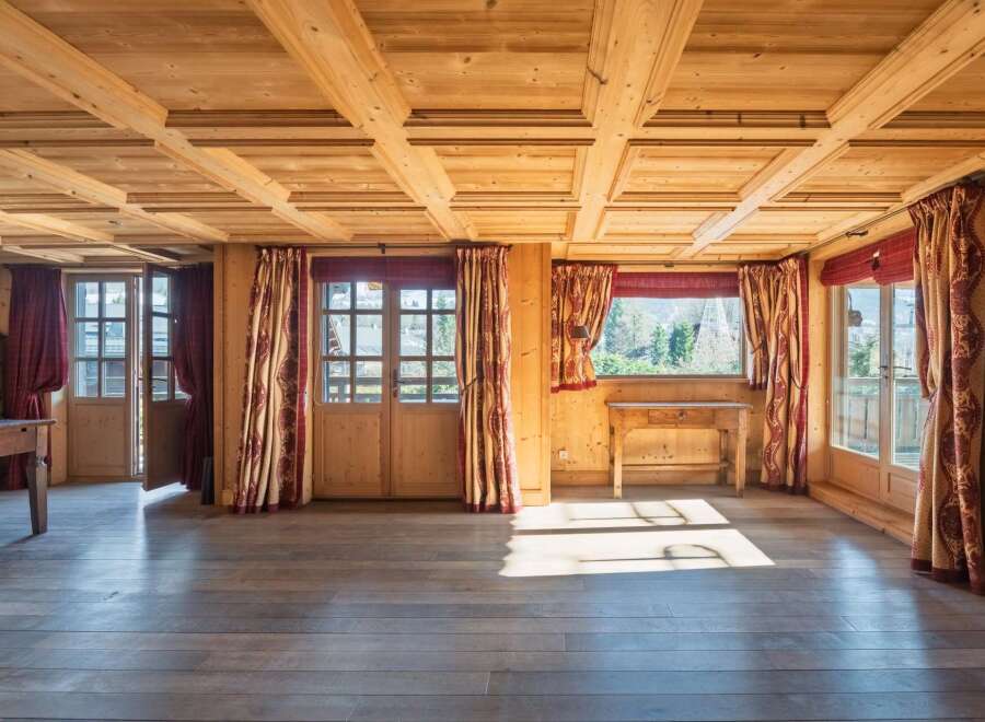 Step into a world of rustic charm with this stunning property, showcasing exquisite wooden ceilings and floors that exude warmth and character.